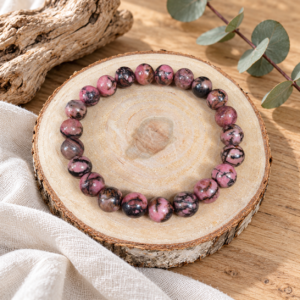 Bracelet en rhodonite rose et noire, perles de 8,8 mm, sur une rondelle de bois clair